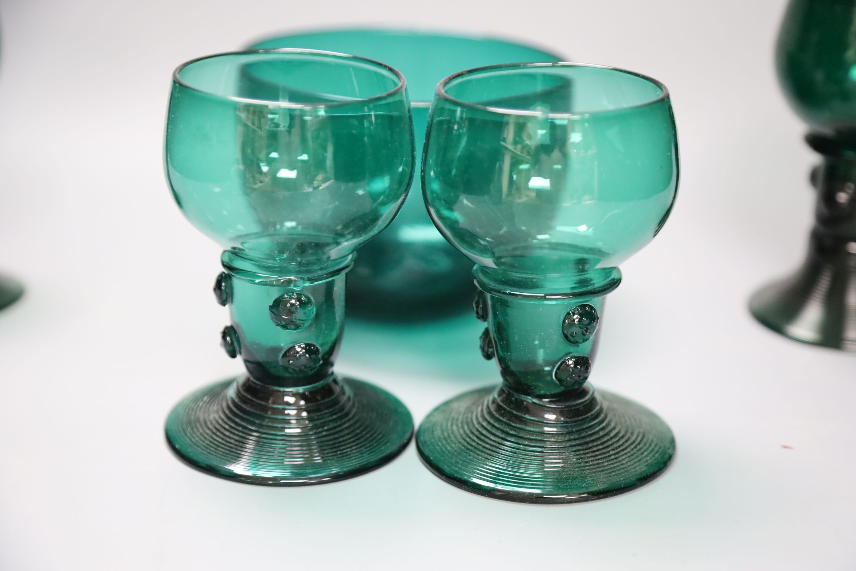 A group of 19th century green glass and a Victorian dump paperweight